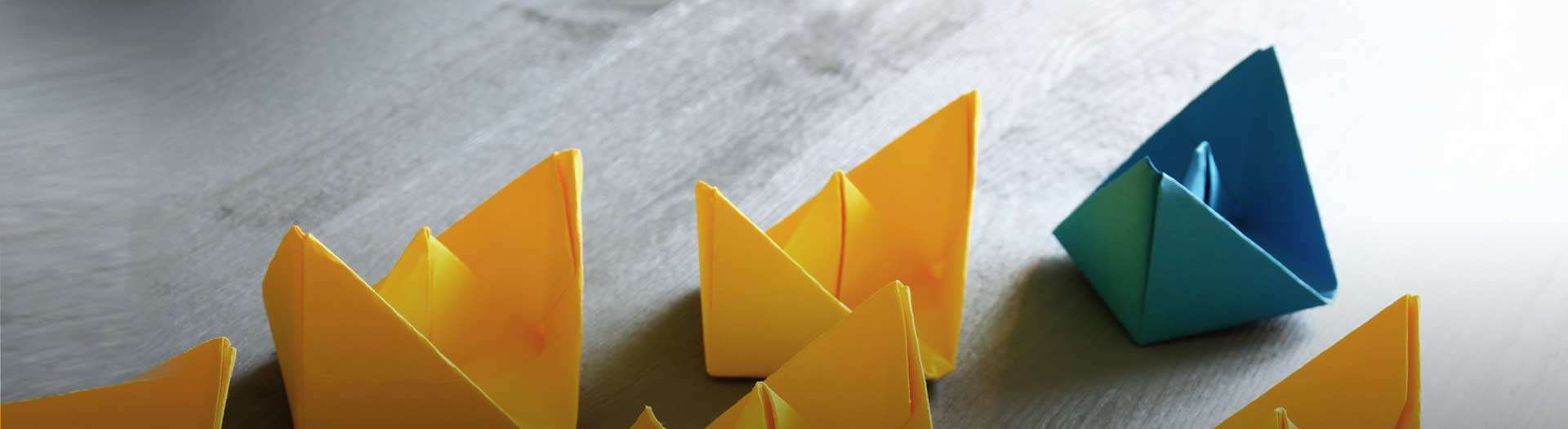 yellow and blue paper boats